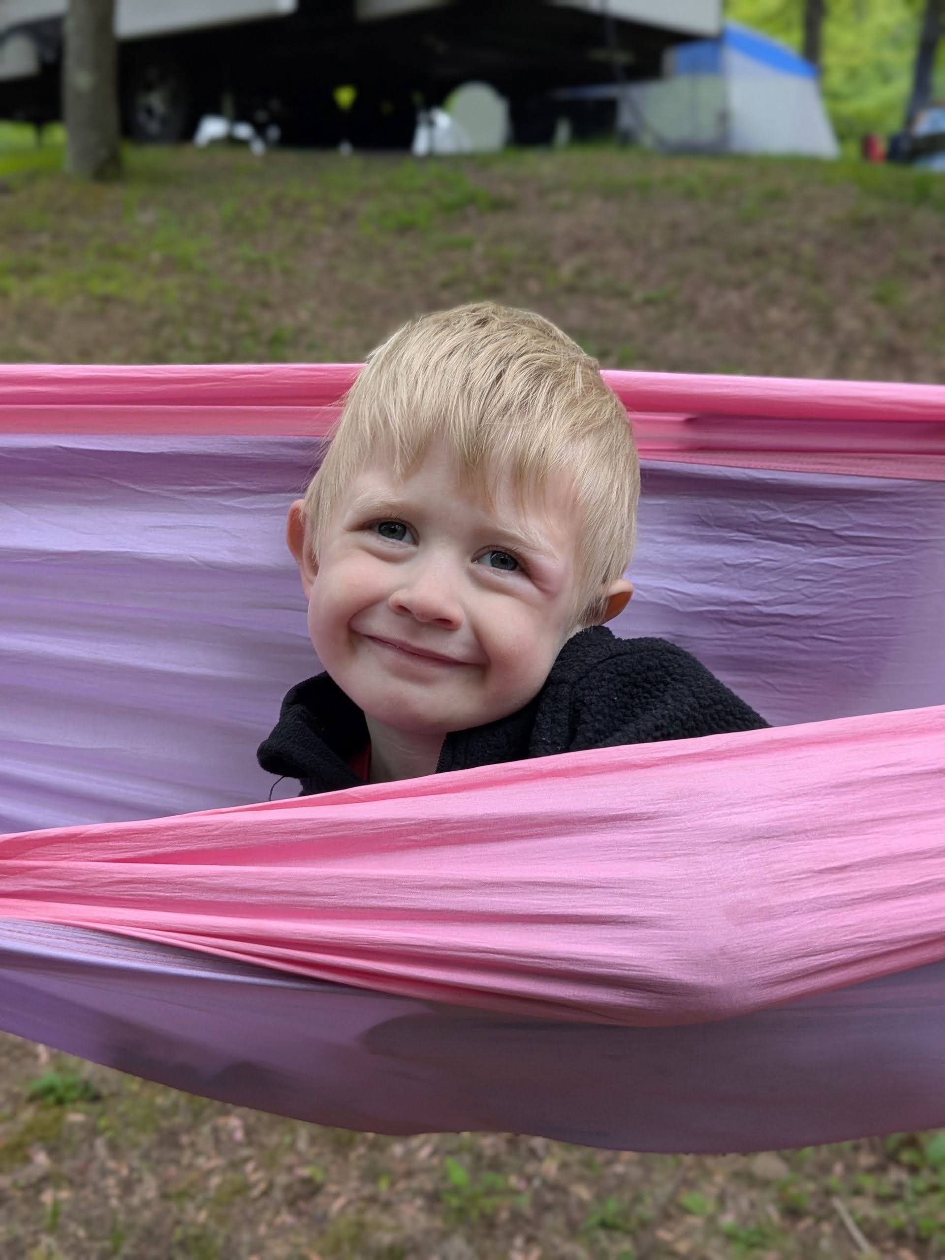 Oscar smiling in a hammock