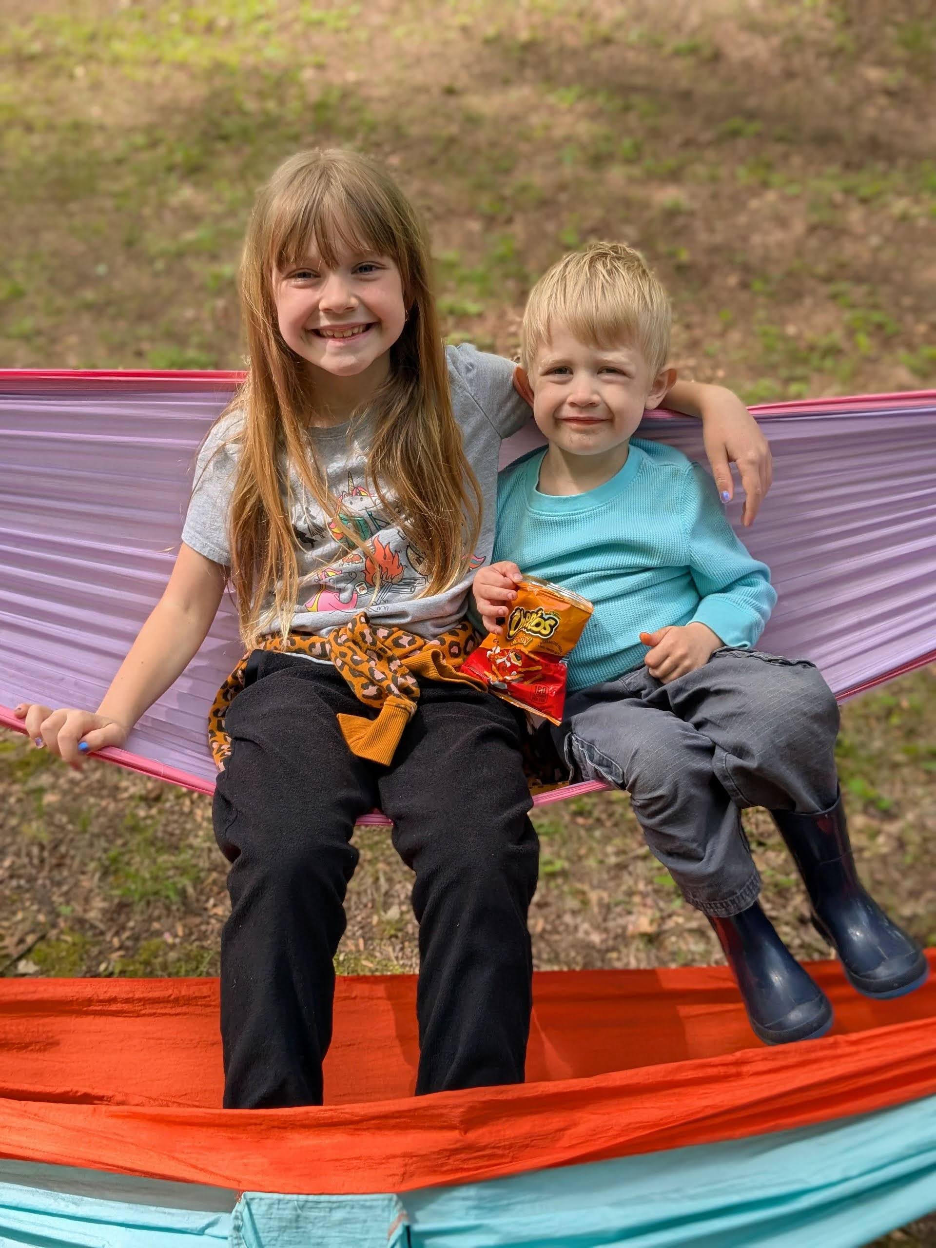 Oscar with his sister on a hammock